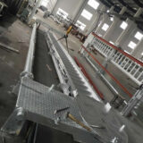 Accommodation ladder with turntable and stowing system